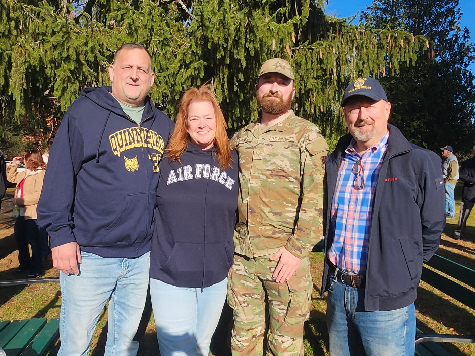 Community members with a veteran at a Wallingford event